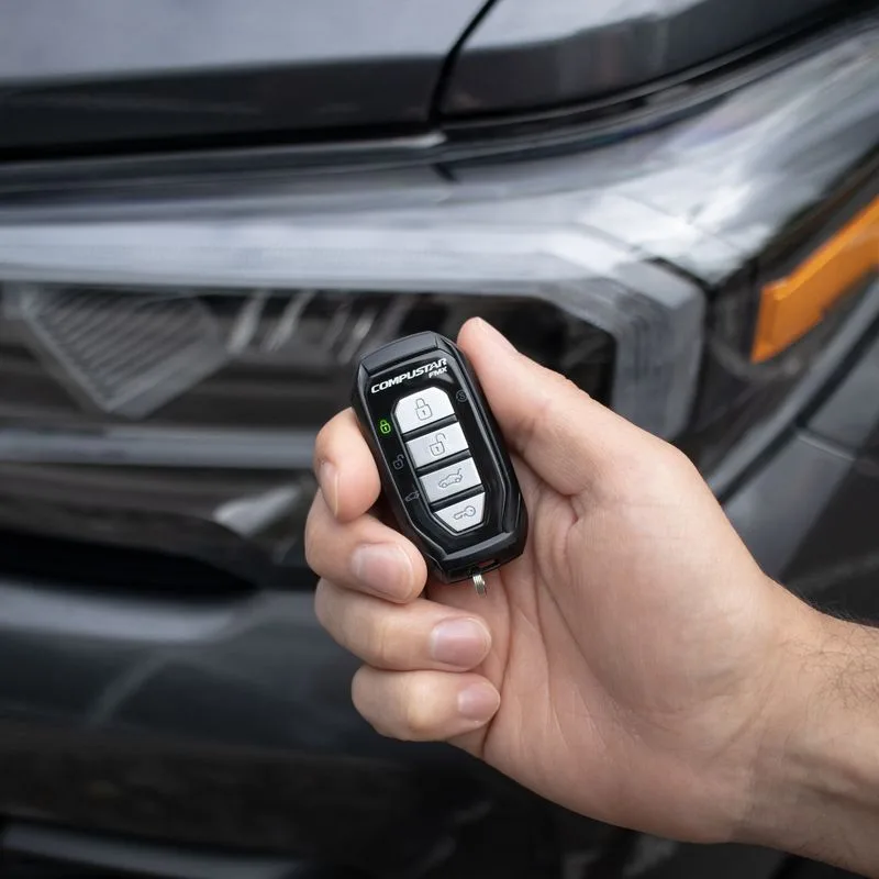 Compustar remote start key fob held in hand